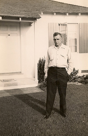 Stanley standing in front of his California house