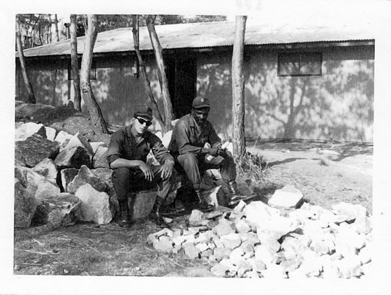 Jim & comrade sitting on rocks ~ Korea 1969
